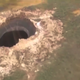 Illustration for article titled A Dramatic 260 Foot Crater Has Mysteriously Appeared In Siberia